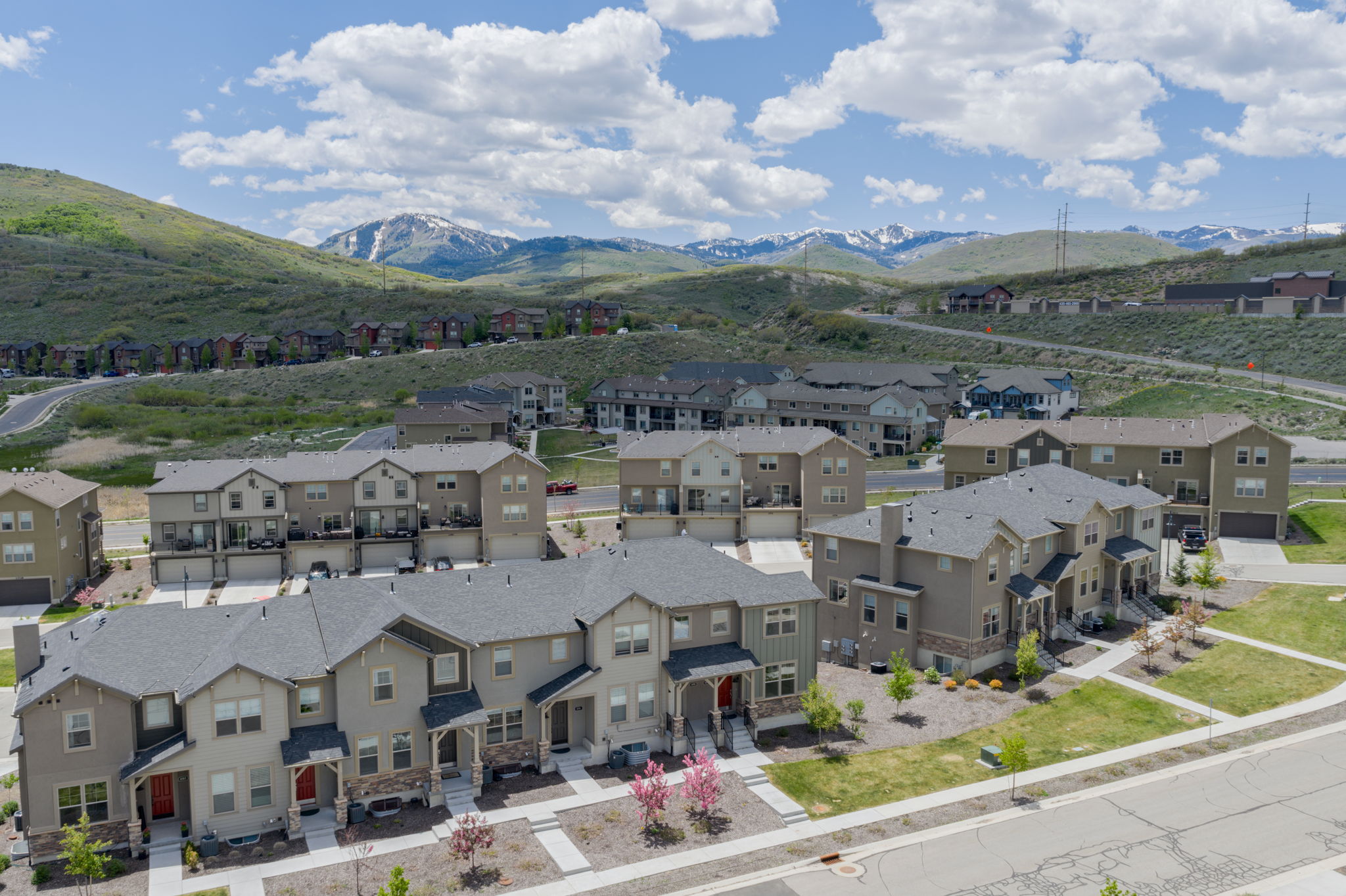 Aerial perspective of suburban area featuring a mountainous background