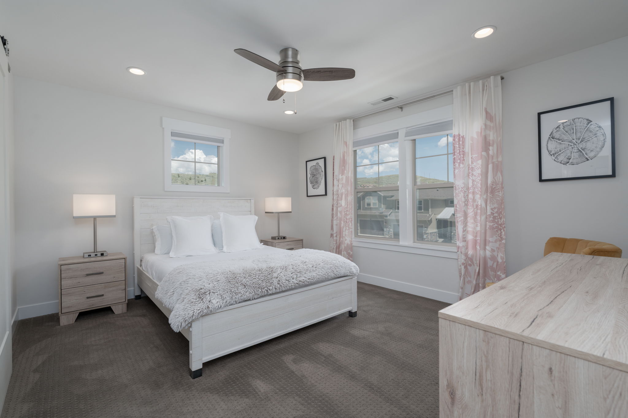 Bedroom featuring dark colored carpet, ceiling fan, multiple windows, and recessed lighting