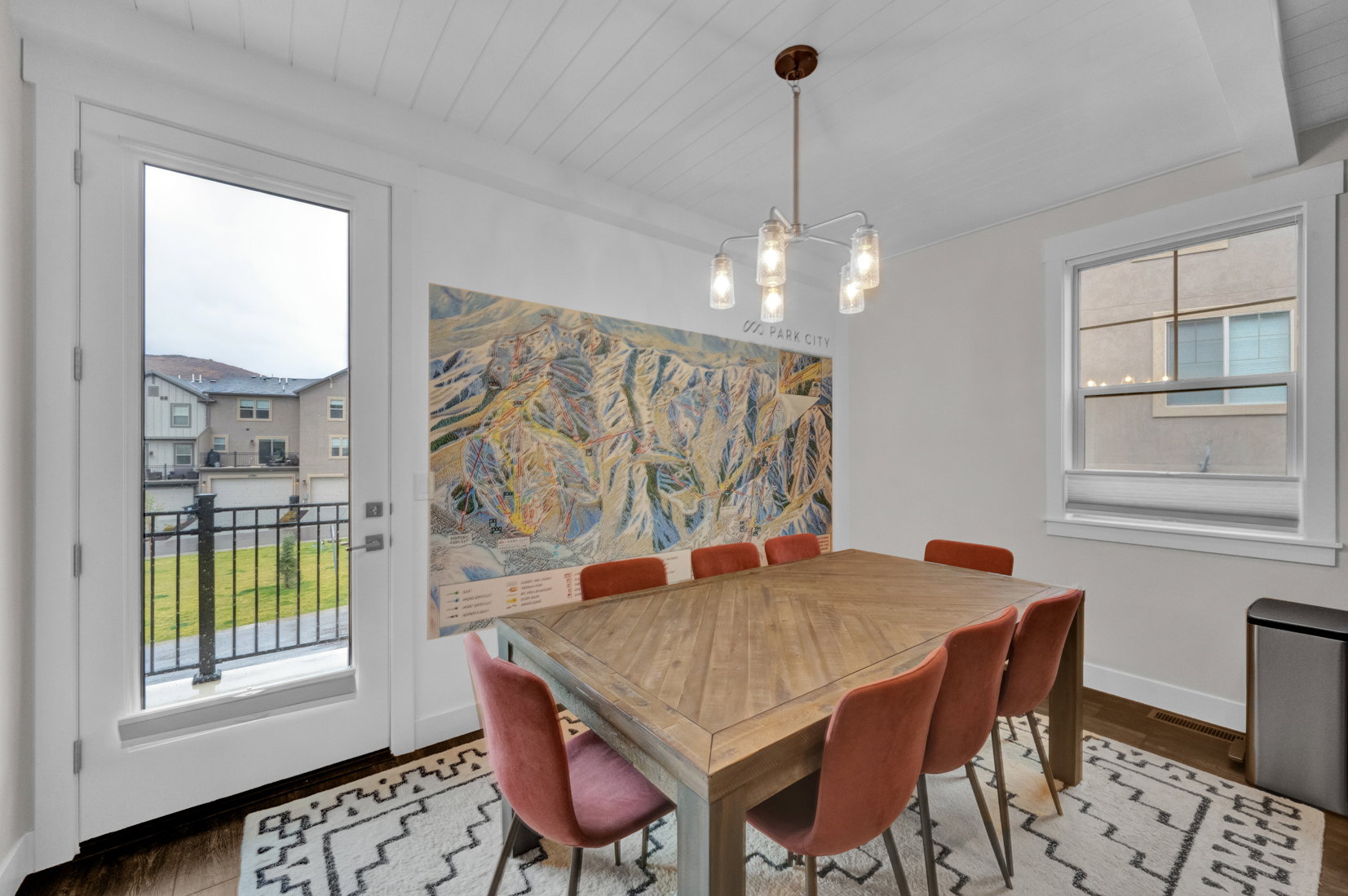 Dining room with hanging lights, wood finished floors, and wood ceiling