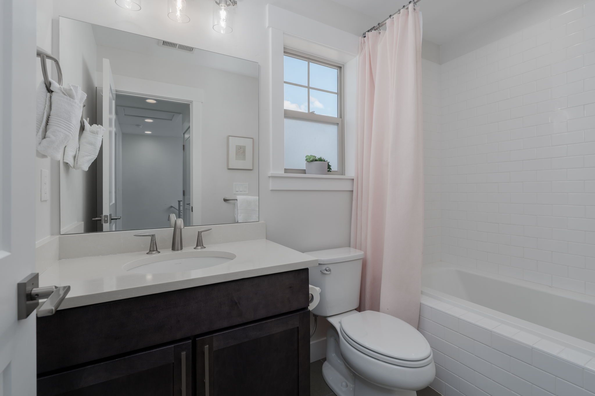 Bathroom featuring vanity and shower / bath combo
