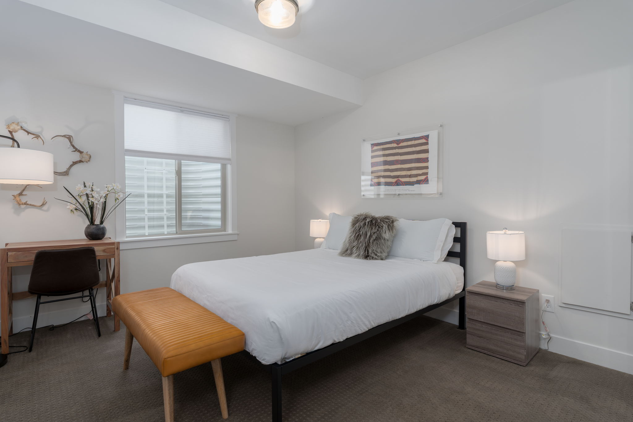 Bedroom featuring carpet floors and baseboards