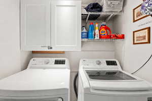 Laundry room featuring washing machine and clothes dryer