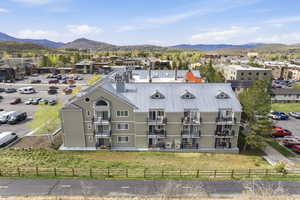 Drone / aerial view of mountains and apartment complex