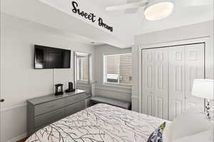 Bedroom with a closet and ceiling fan