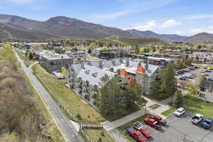 Aerial view of mountains and apartment complex / building