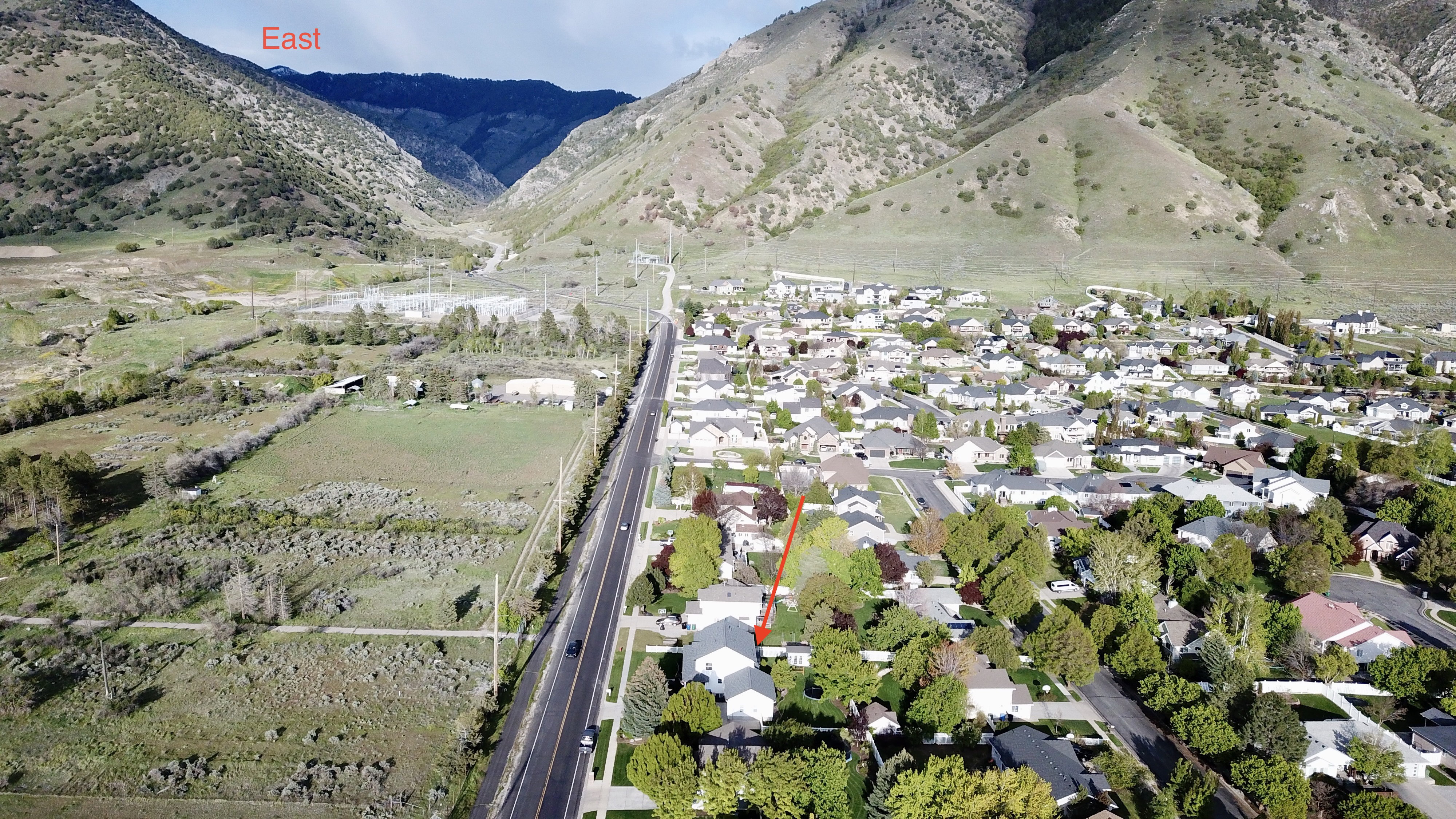 Suburban neighborhood setting with established street infrastructure and mature trees