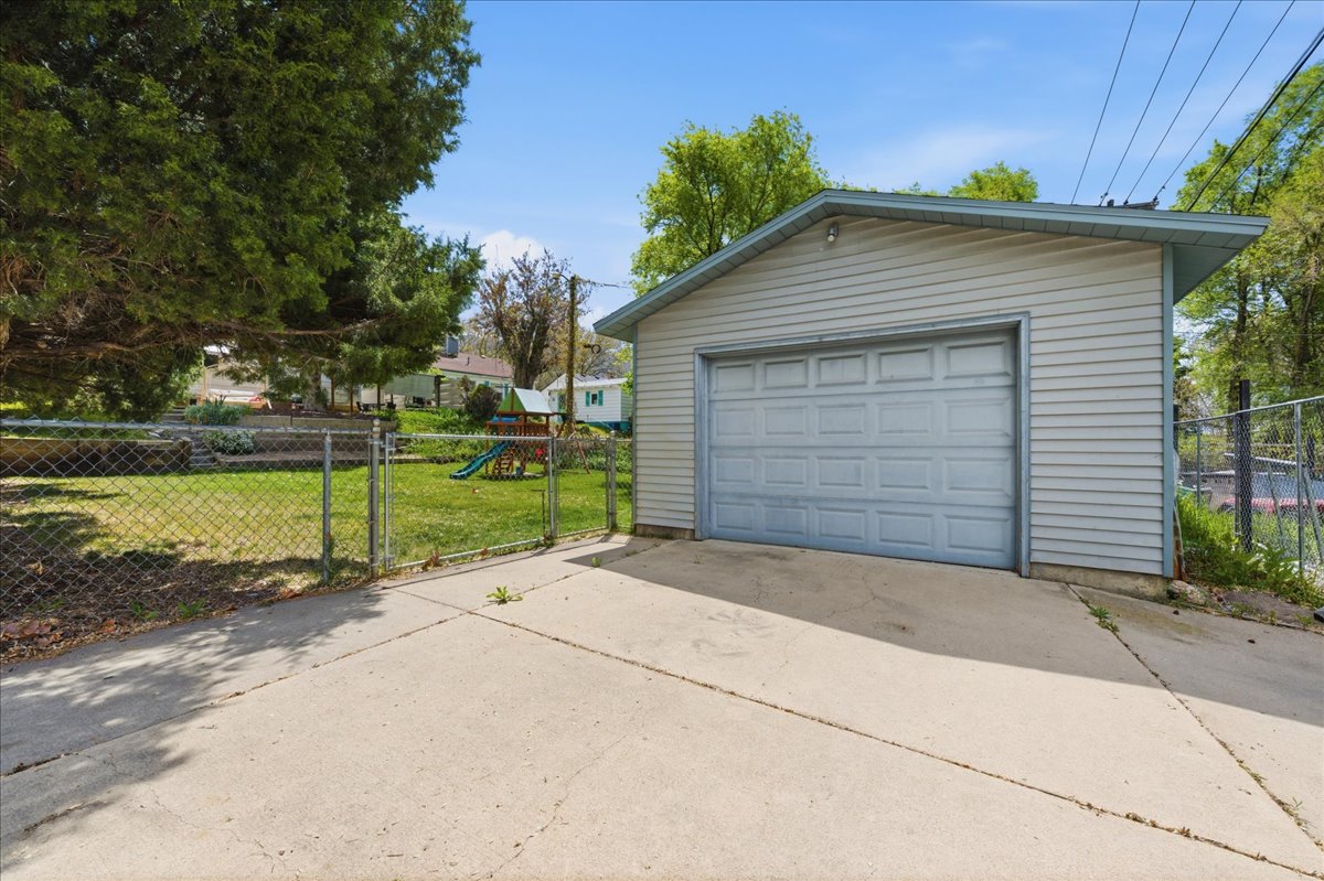 Detached garage featuring driveway
