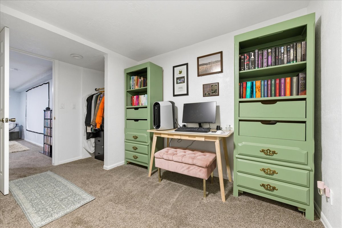 Office with light carpet and baseboards