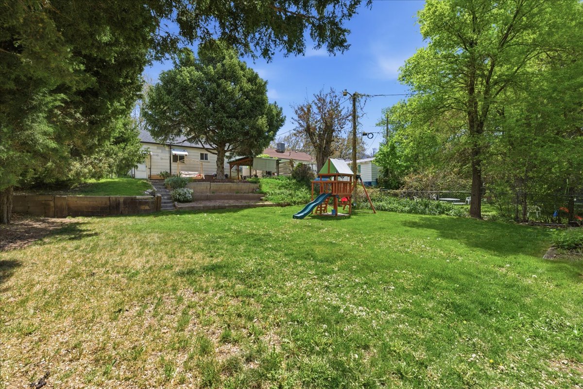 View of yard with a playground