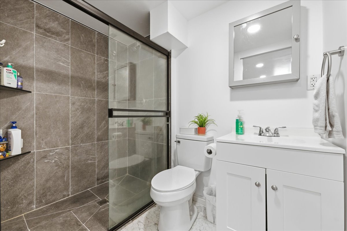 3/4 Bathroom featuring vanity and a shower stall