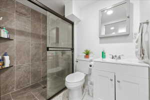 3/4 Bathroom featuring vanity and a shower stall