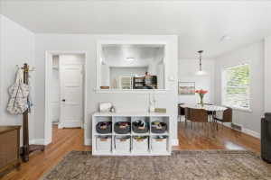 Kitchen featuring dark wood finished floors and baseboards