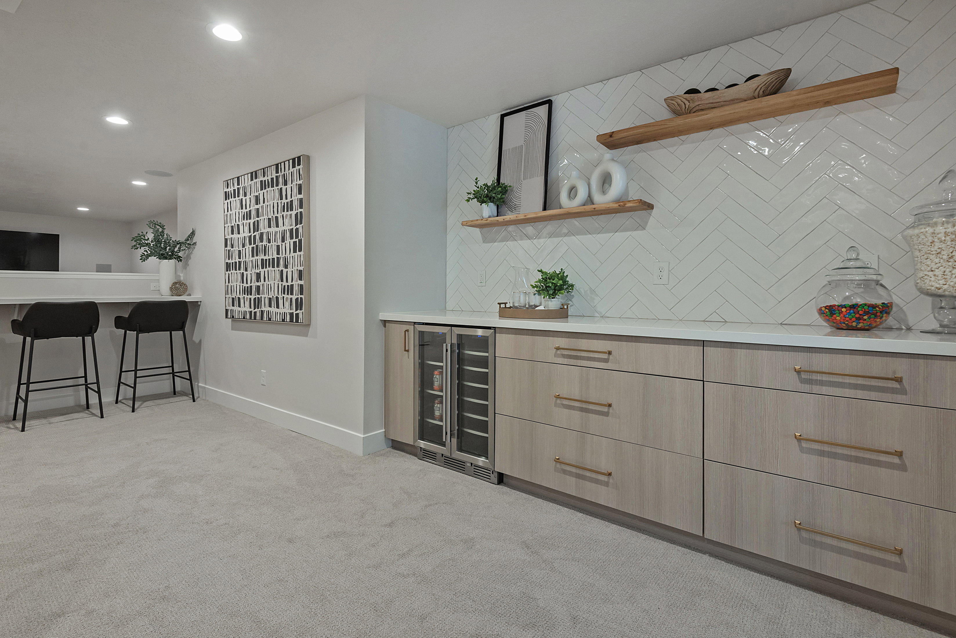 Wet bar with modern cabinets, open shelves, light wood finish cabinets, light carpet, and recessed lighting