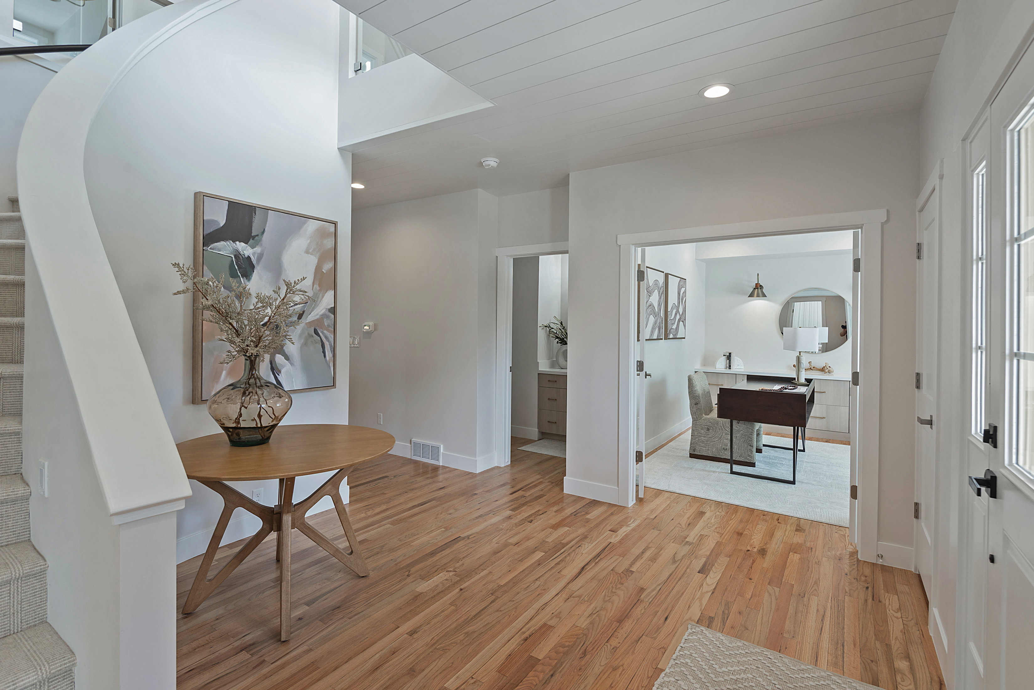 Entryway featuring light wood-type flooring and recessed lighting