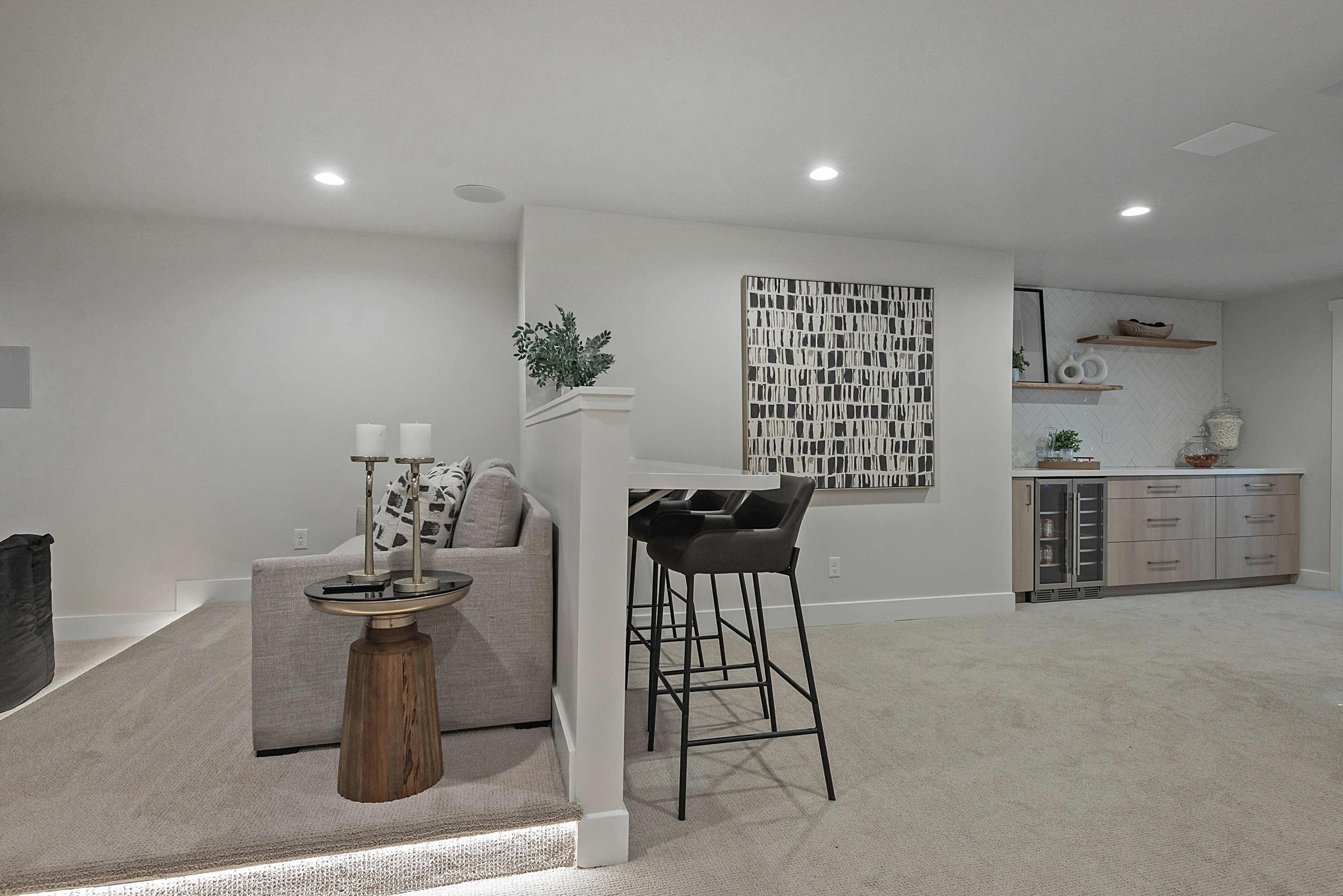 Living room with light colored carpet, recessed lighting, a dry bar, and beverage cooler