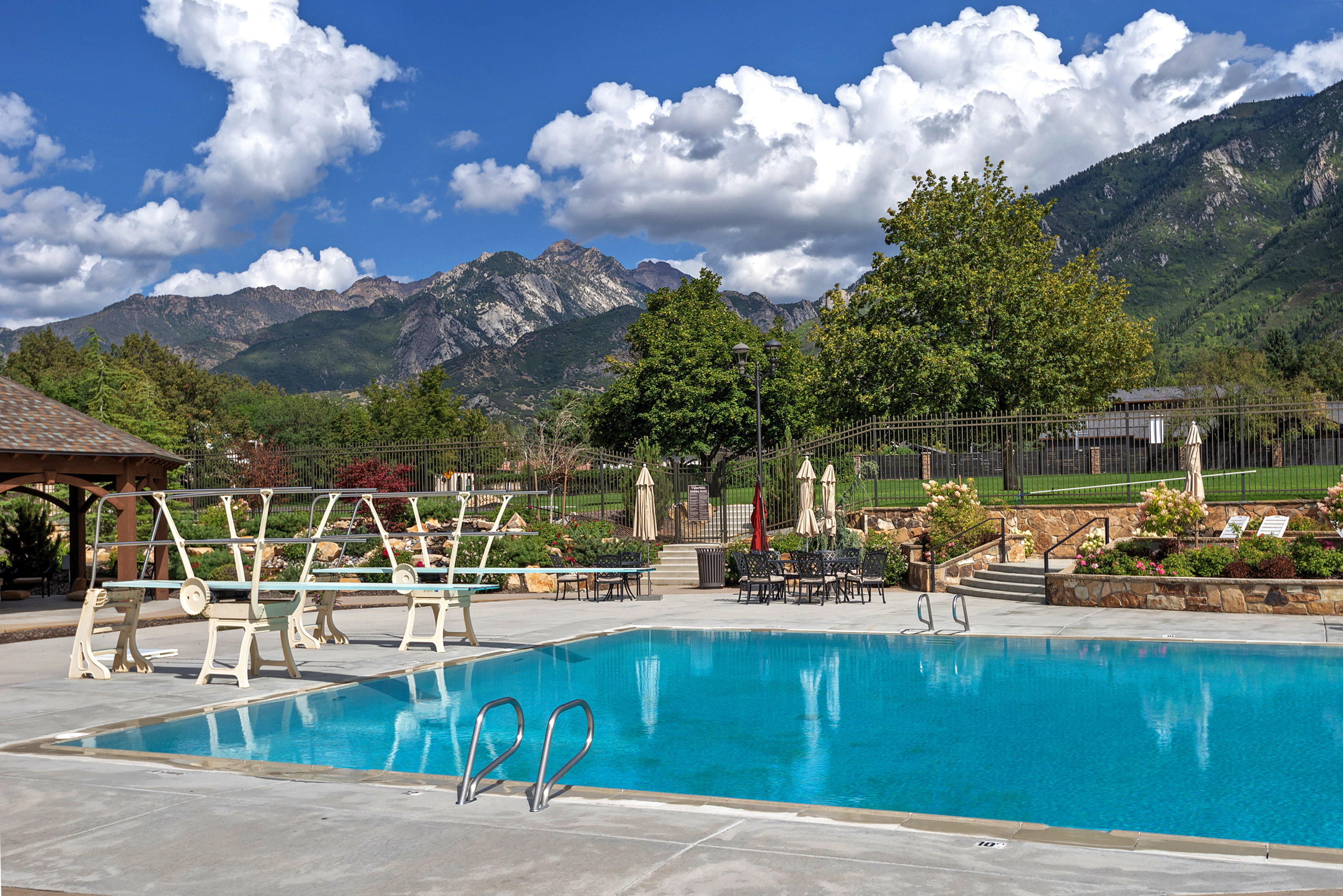 Community pool featuring a patio and a mountain view