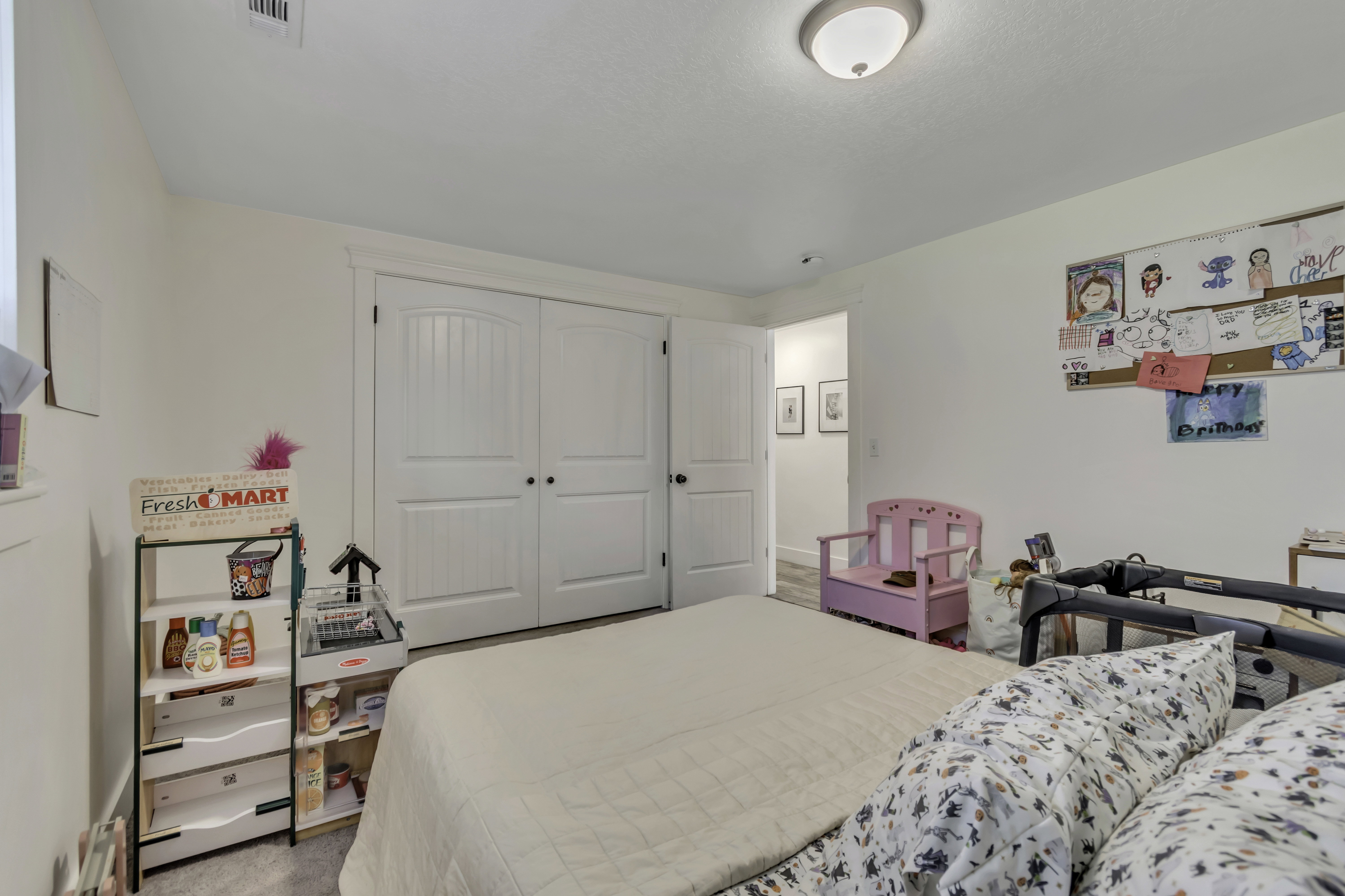 Bedroom featuring a closet and light colored carpet