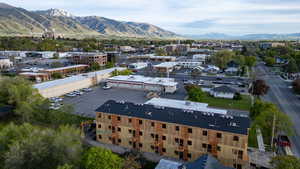 New construction building featuring multiple levels and a dark roof