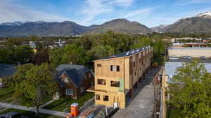 New construction townhomes featuring multi-level design, individual balconies, and a sloped roofline