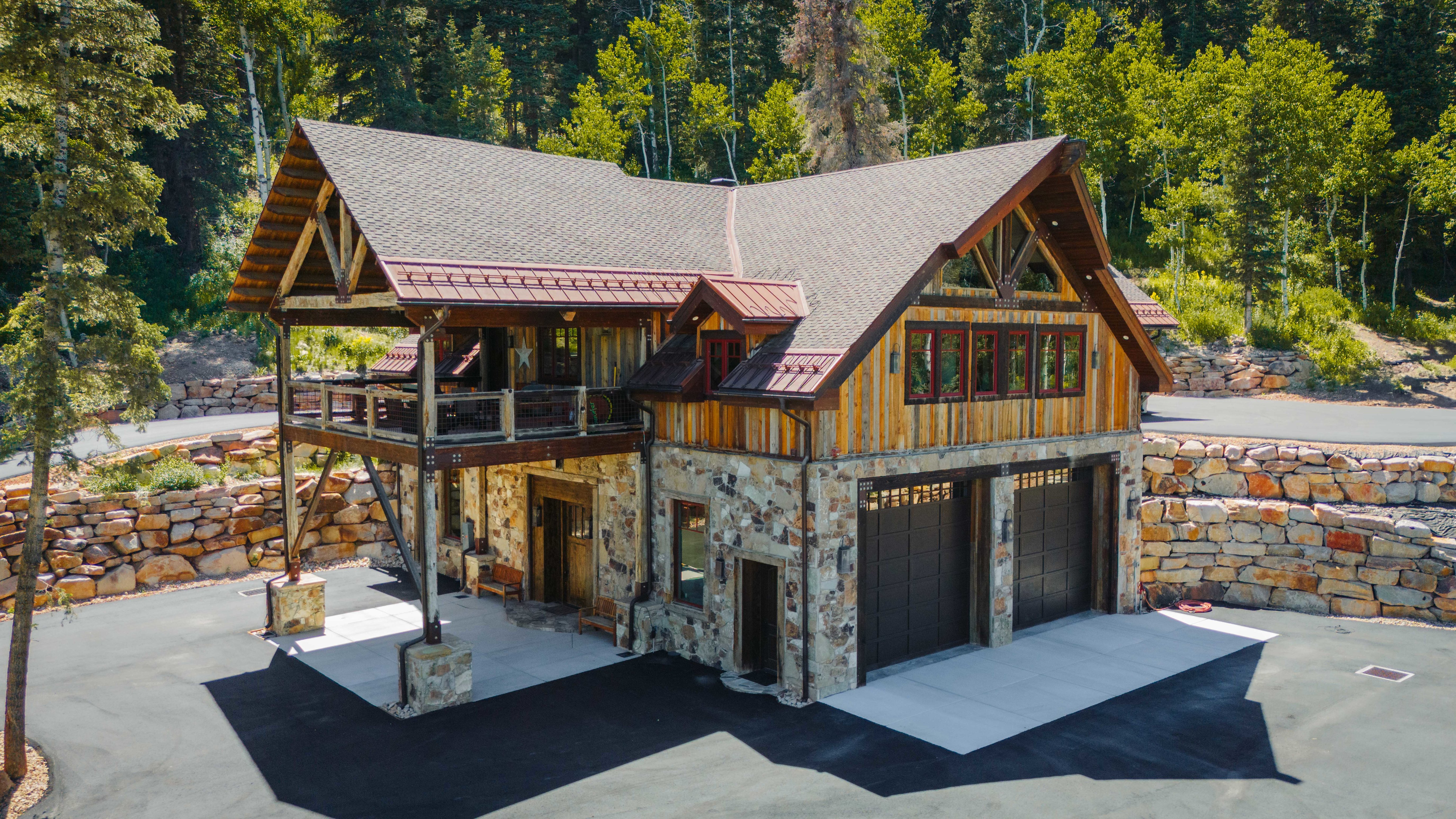 Mountain-style residence featuring a stone and wood siding exterior