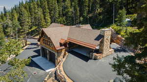Rustic-inspired exterior featuring natural wood siding and stone accents