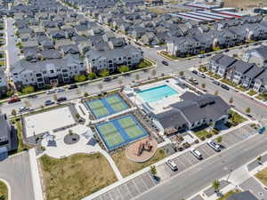 Community amenities featuring a swimming pool, two tennis courts, a sand volleyball court, and a playground