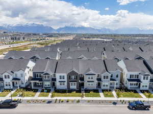 Modern townhome community featuring diverse siding materials and gabled roofs