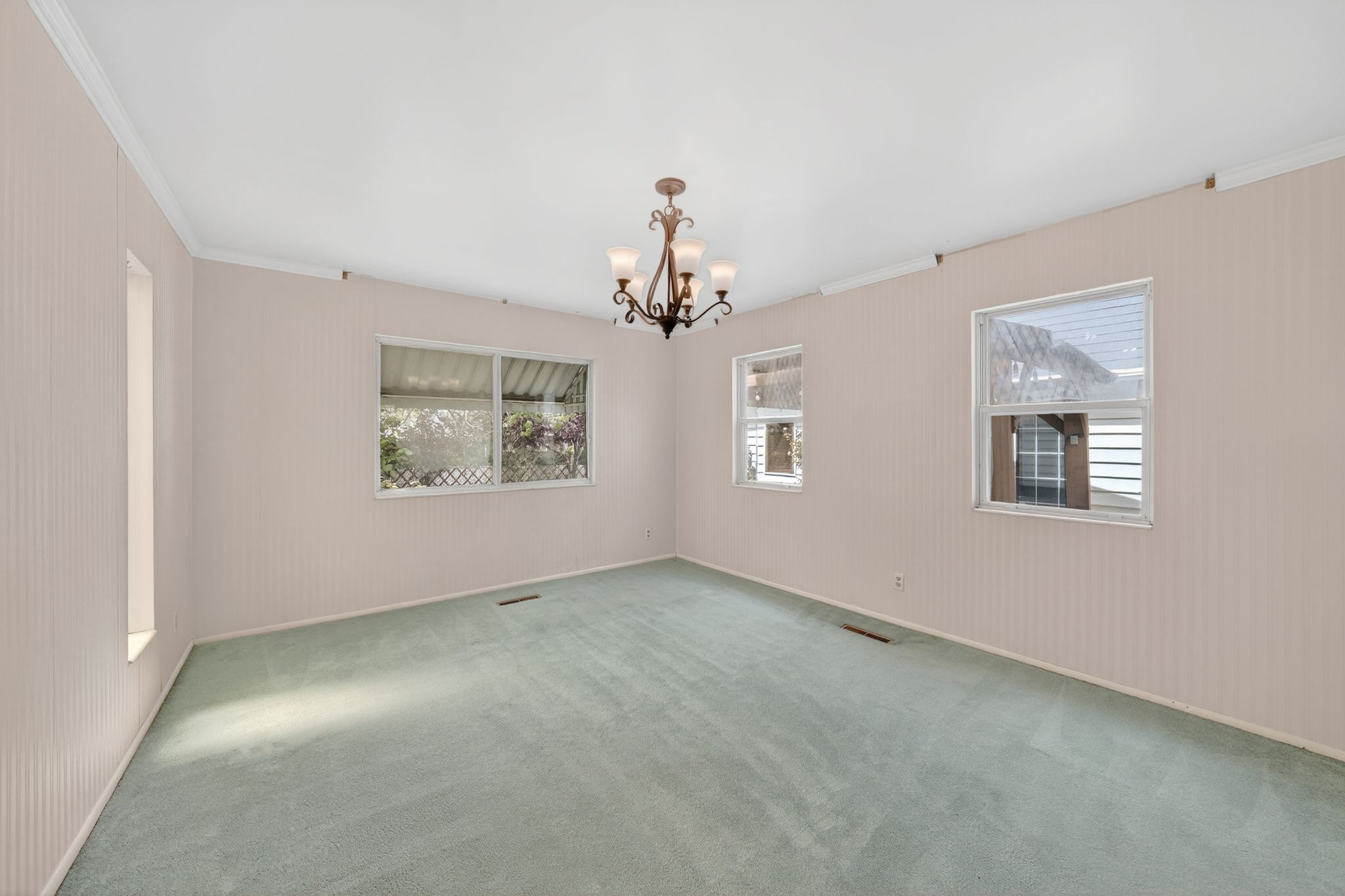 Interior space featuring light-colored walls and green carpeting