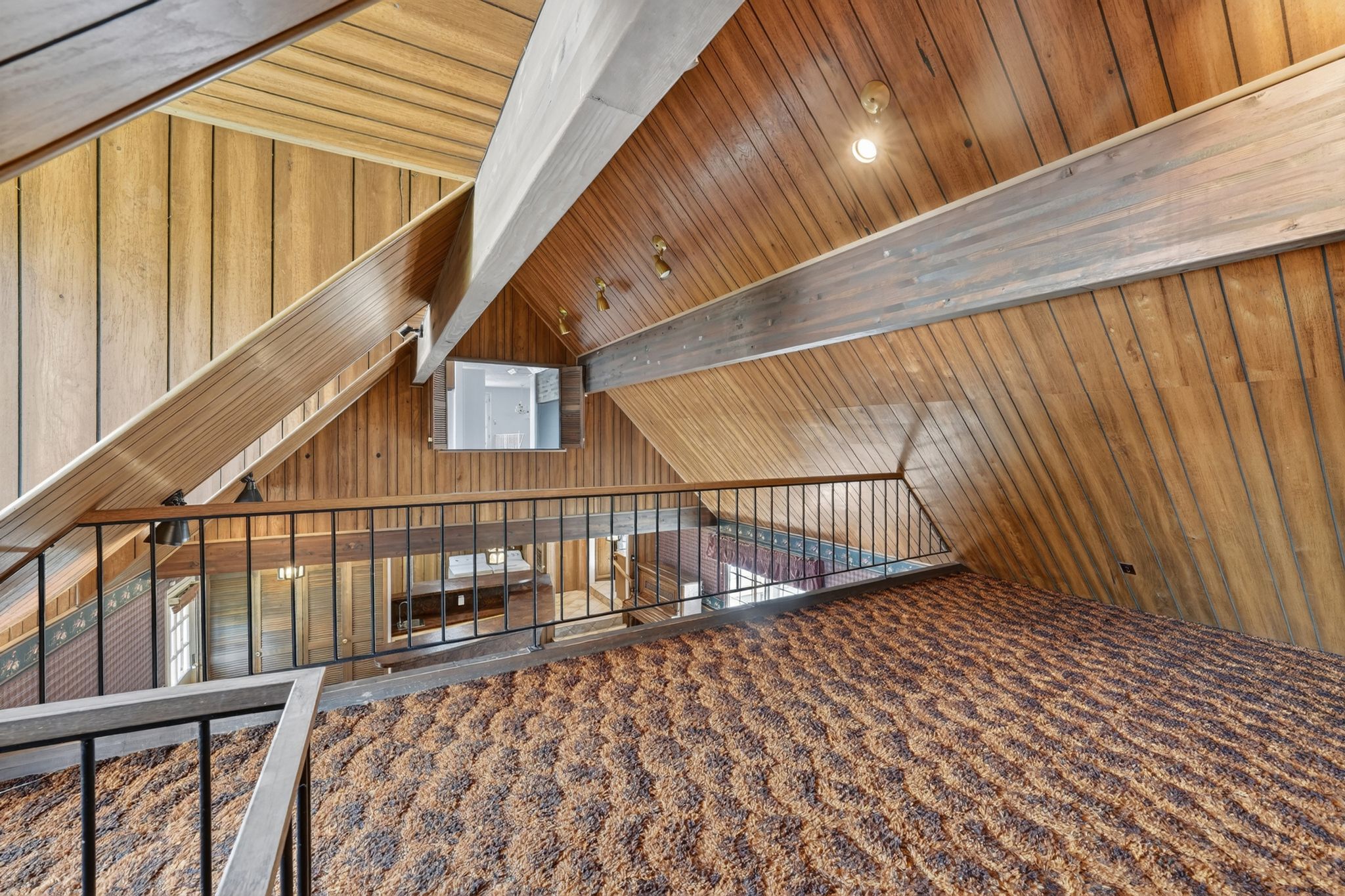 Vaulted wood-paneled ceilings with exposed wood beams