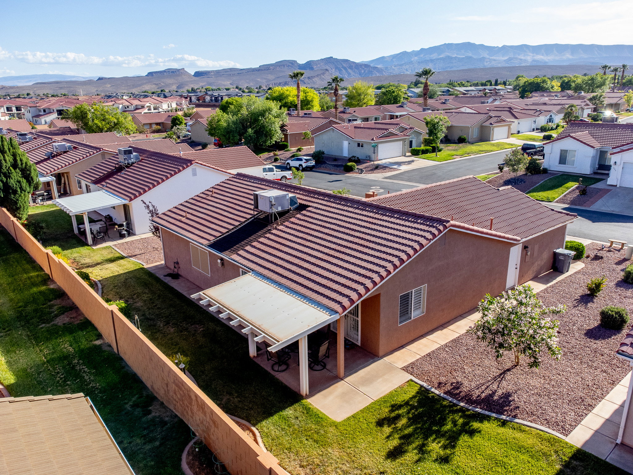 Aerial perspective showcasing a residential property with a tile roof and stucco exterior
