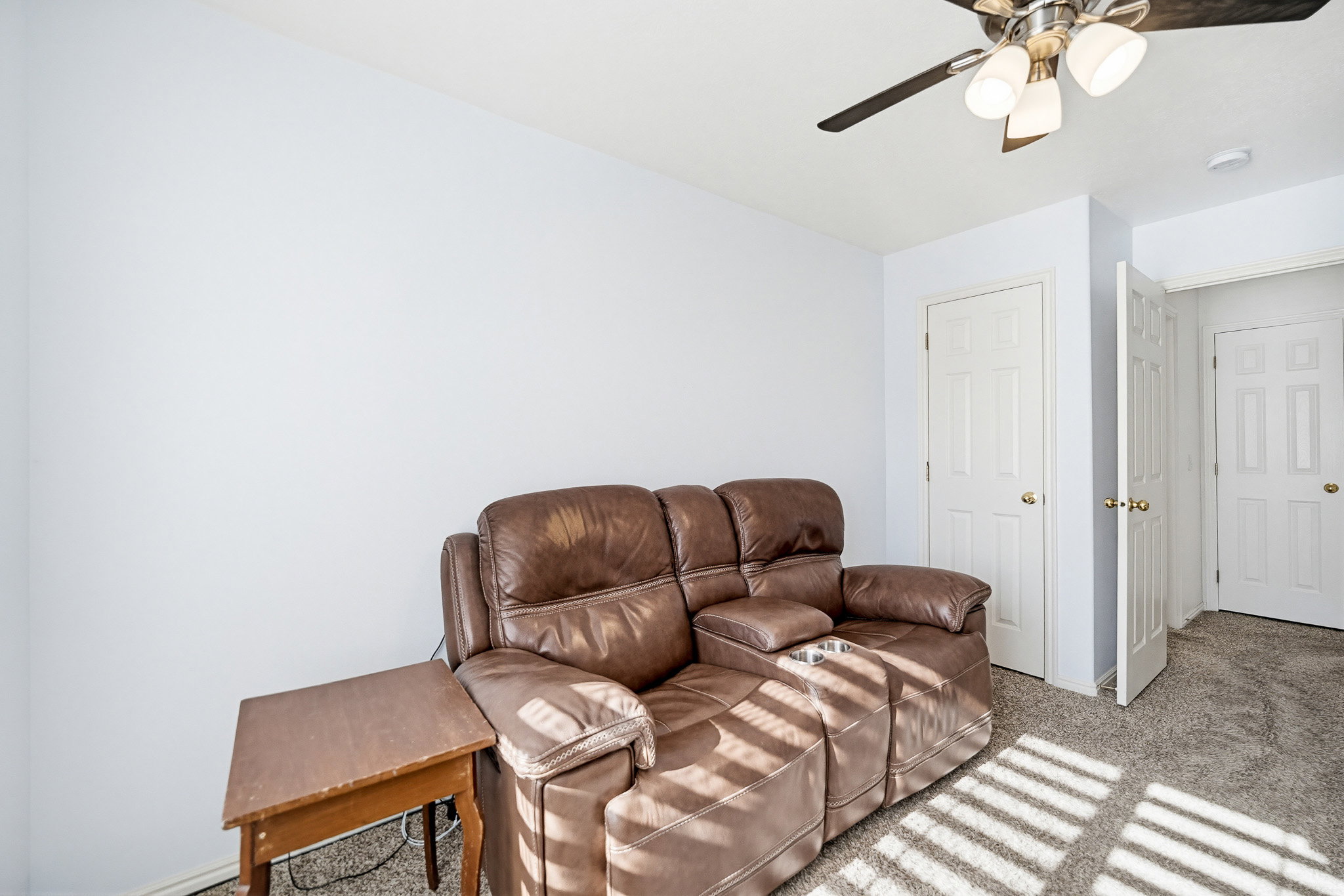 Room featuring light-colored walls and carpeted flooring