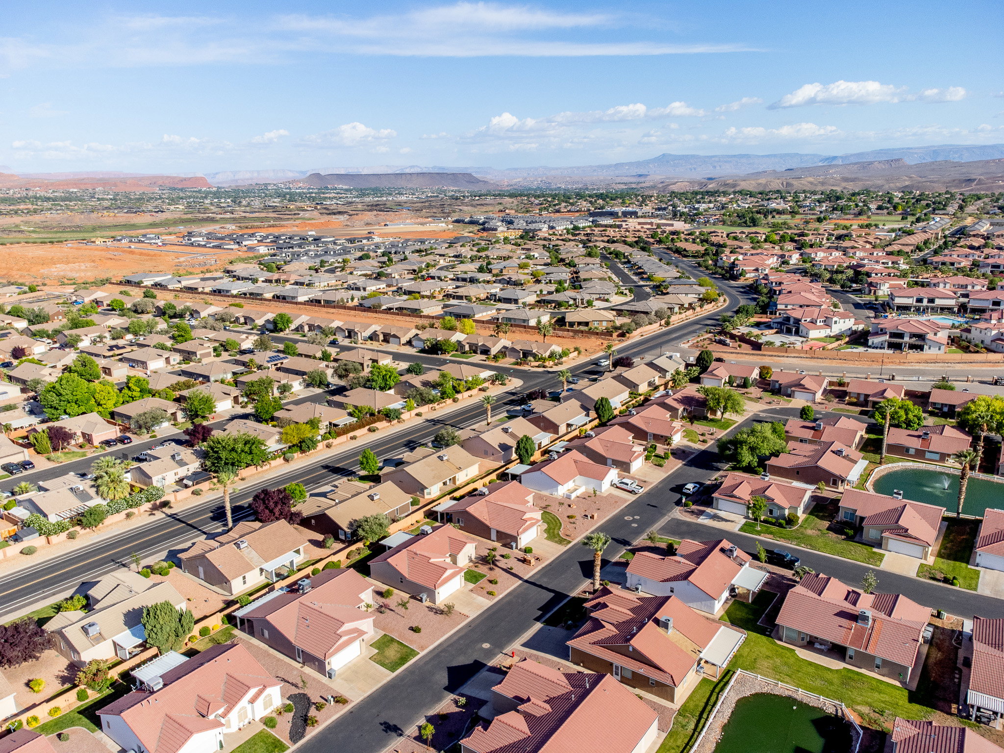 Expansive aerial perspective showcasing a residential neighborhood with diverse housing styles