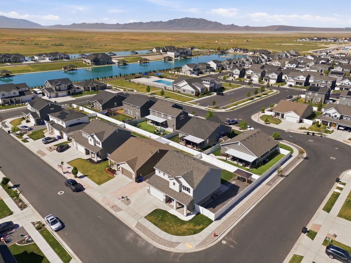 Residential community featuring single-family homes with pitched roofs and attached garages