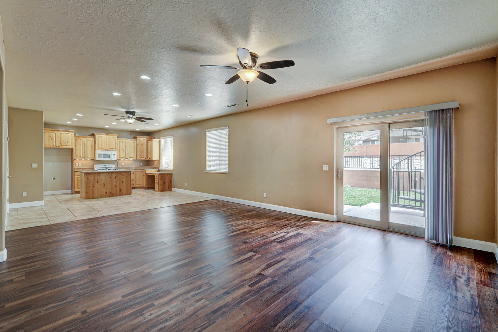 Open-concept living space with dark wood-finish flooring