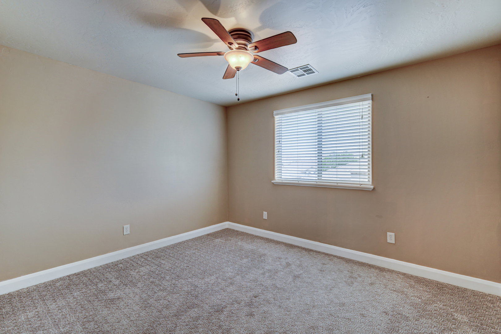 Neutral-toned carpeting paired with light beige walls