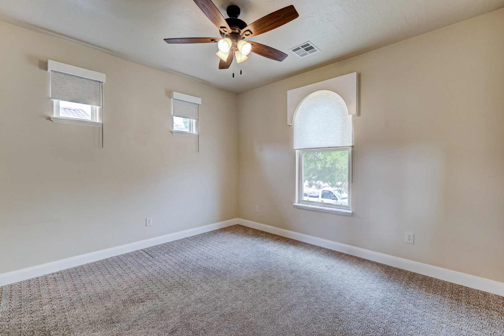Neutral-toned carpeting paired with light wall finishes