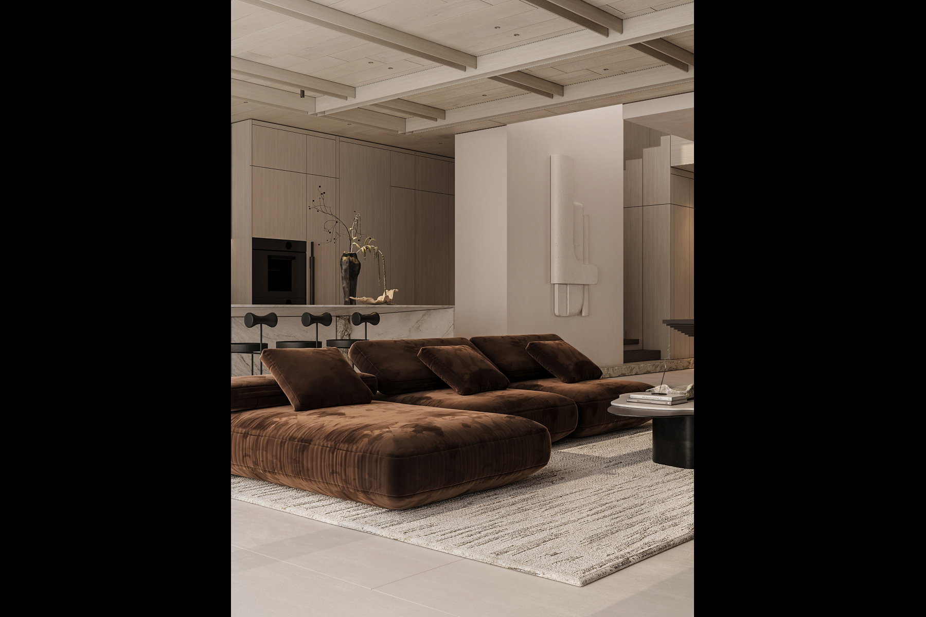 Open-concept living area featuring a neutral color palette, integrated kitchen cabinetry, built-in oven, and a marble-top island with seating