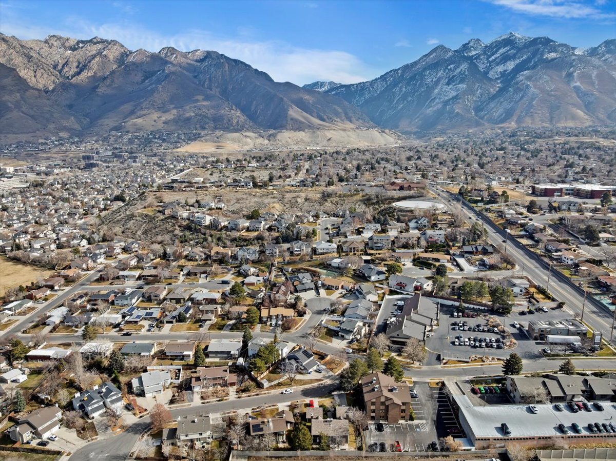 Mountainous backdrop framing a residential and commercial area