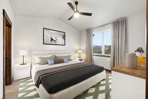 Vaulted ceiling featuring a ceiling fan with integrated lighting