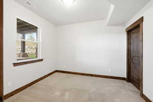 Neutral wall paint with contrasting wood-finish trim and doors