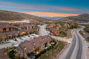 Newly constructed townhomes featuring multi-level designs and covered porches