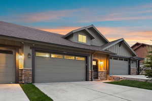 Contemporary exterior featuring horizontal and vertical siding with stone accents