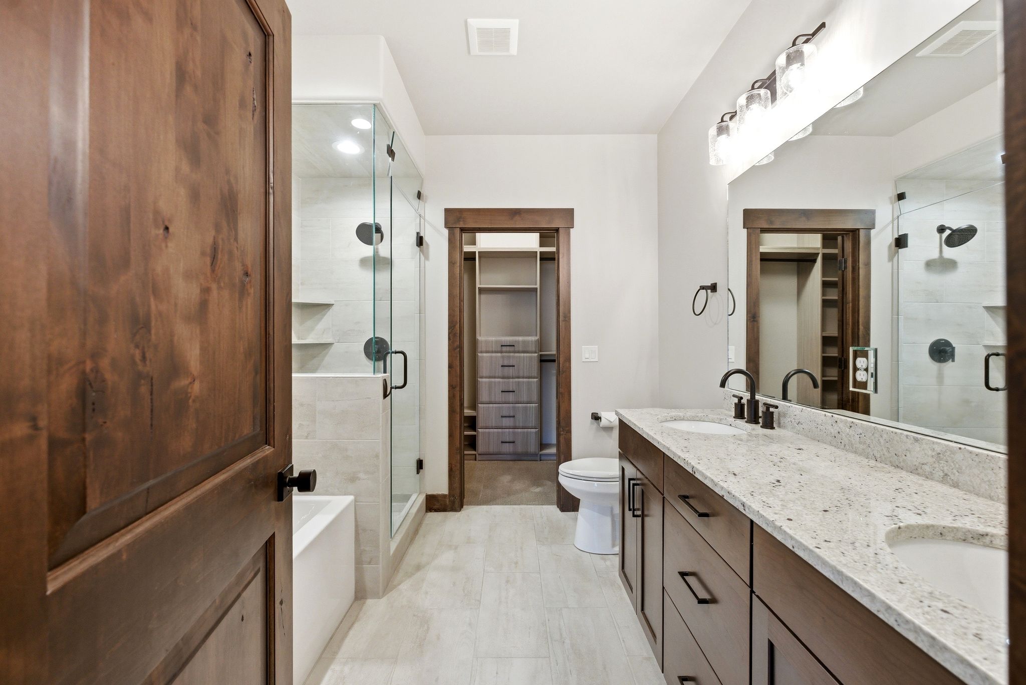 Double vanity with stone countertop and integrated sinks