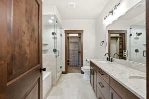 Double vanity with stone countertop and integrated sinks