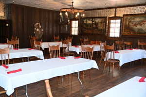 Interior space featuring wood-finish flooring, paneled walls, and a textured ceiling