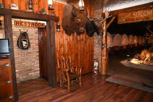 Wood-finish flooring and brick wall detailing