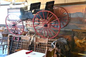 Decorative wagon wheel feature with red-painted spokes