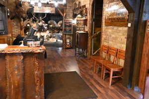 Rustic wood-finish flooring complemented by exposed brick walls