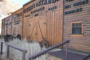 Rustic wood-paneled exterior featuring a prominent double-door entry