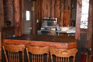 Wood-finished bar with a substantial countertop